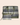 Navy tartan + green | grey
Olive Patent Leather Trim. Navy and white pinstripe interior. Canvas base.
Plaid bag with green strap on a white background