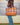 Terracotta plaid + grape | aqua
Terracotta Patent Leather Trim. Stone and white pinstripe interior. Canvas base.
Plaid tote bag with brown leather handles and trim on a white background