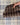 Chocolate windowpane + sand | ivory
Stone Patent Leather Trim. Stone and white pinstripe interior. Brown checkered clutch on a white background
